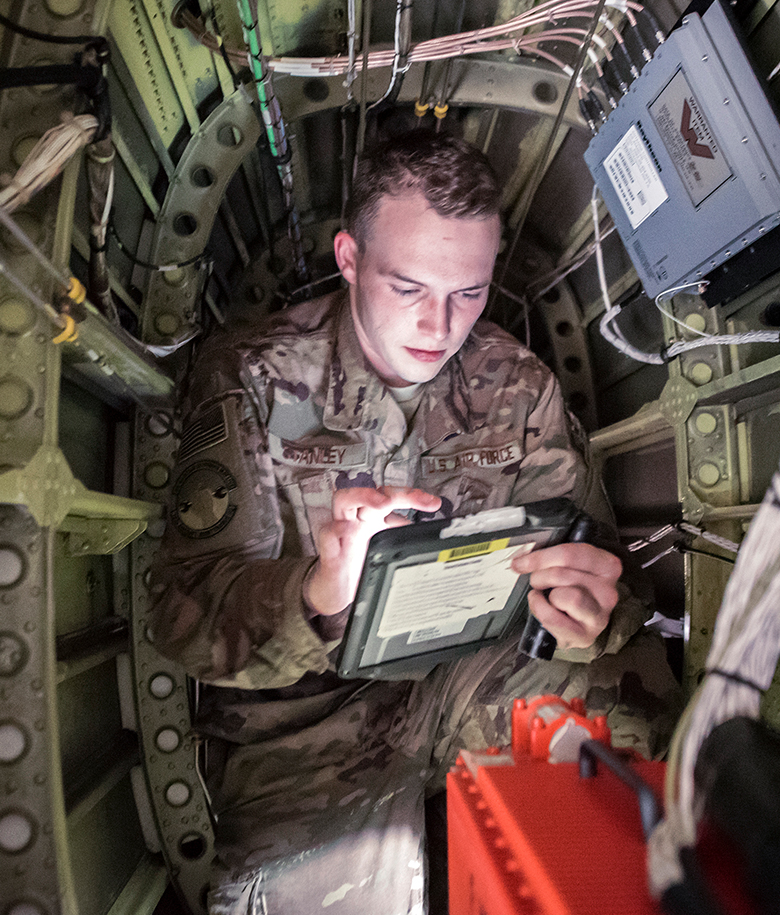 airmen working in cockpit