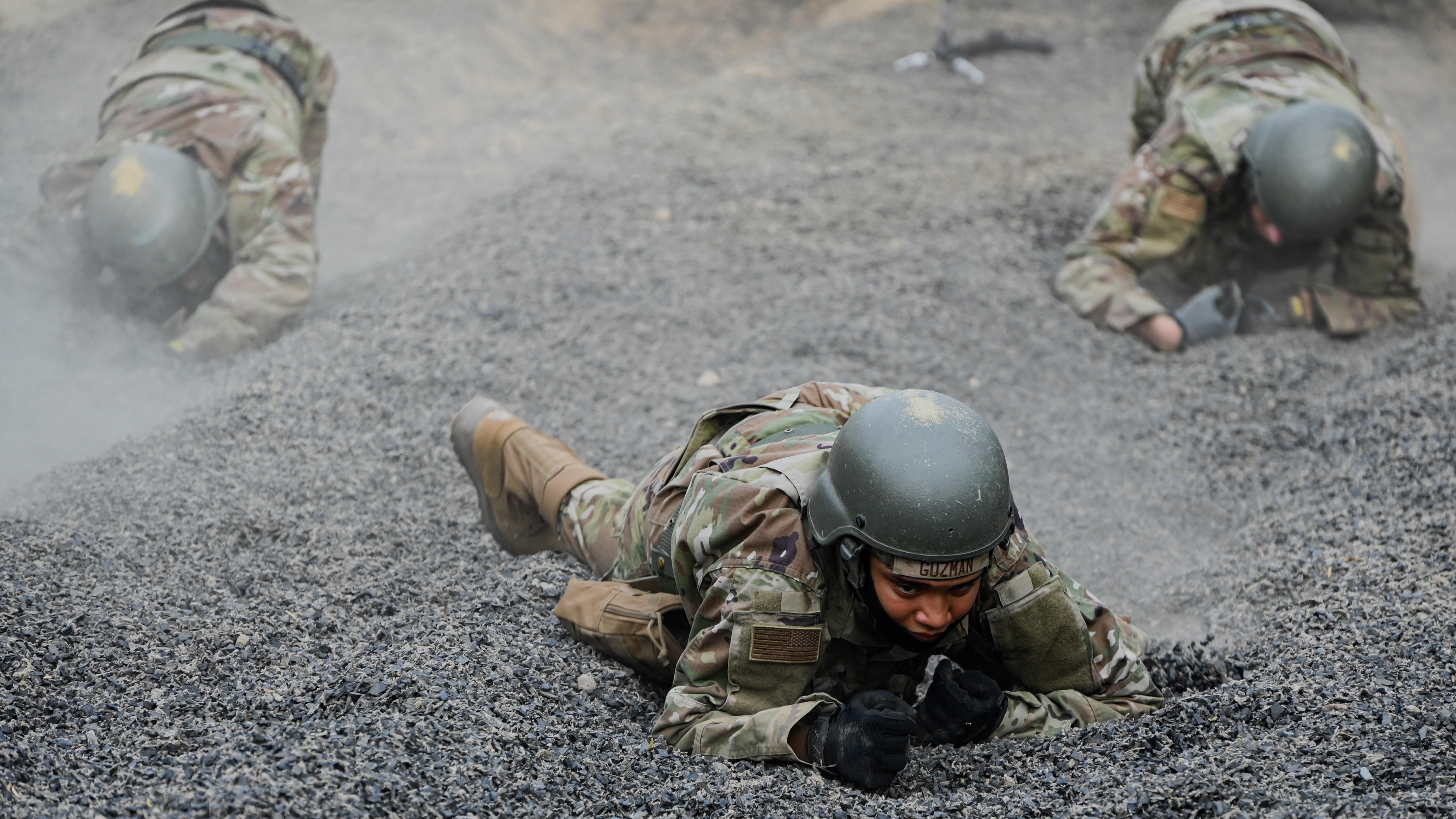 airmen crawling through gravel