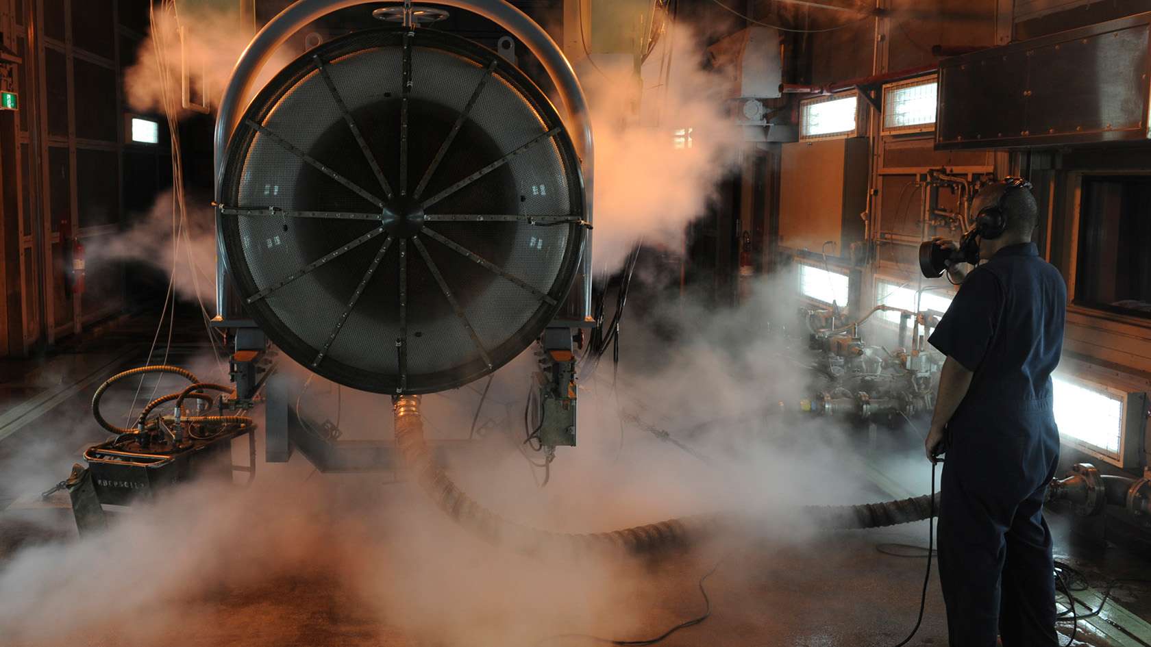airman conducting test and maintenance on engine