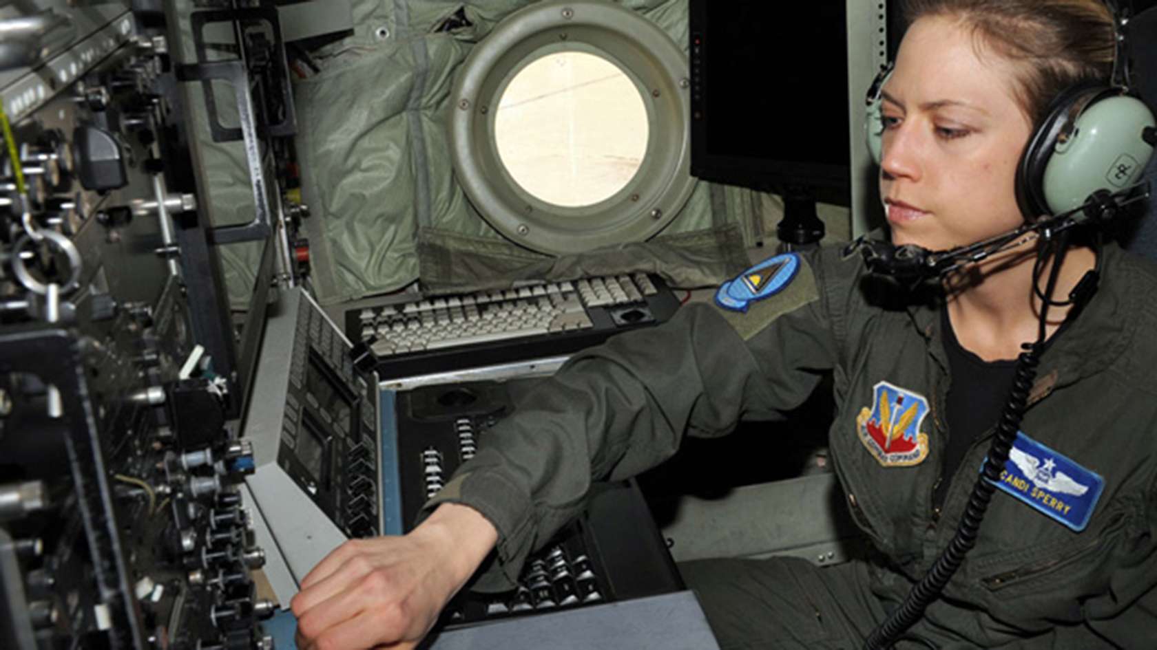 CRYPTOLOGIC ANALYST AND REPORTER WEARING HEADSET
