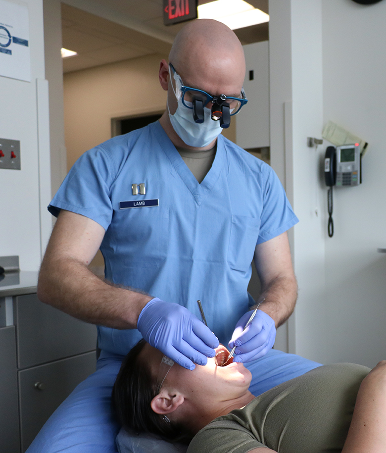 Dentist Checking Patients Teeth