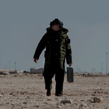 Explosive Ordnance Disposal specialist  walking with equipment