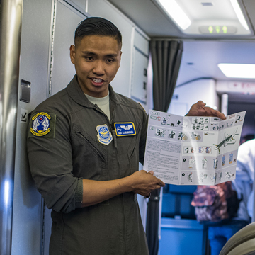 flight attendant going over emergency instructions