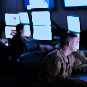 Intelligence Analysts working at computers