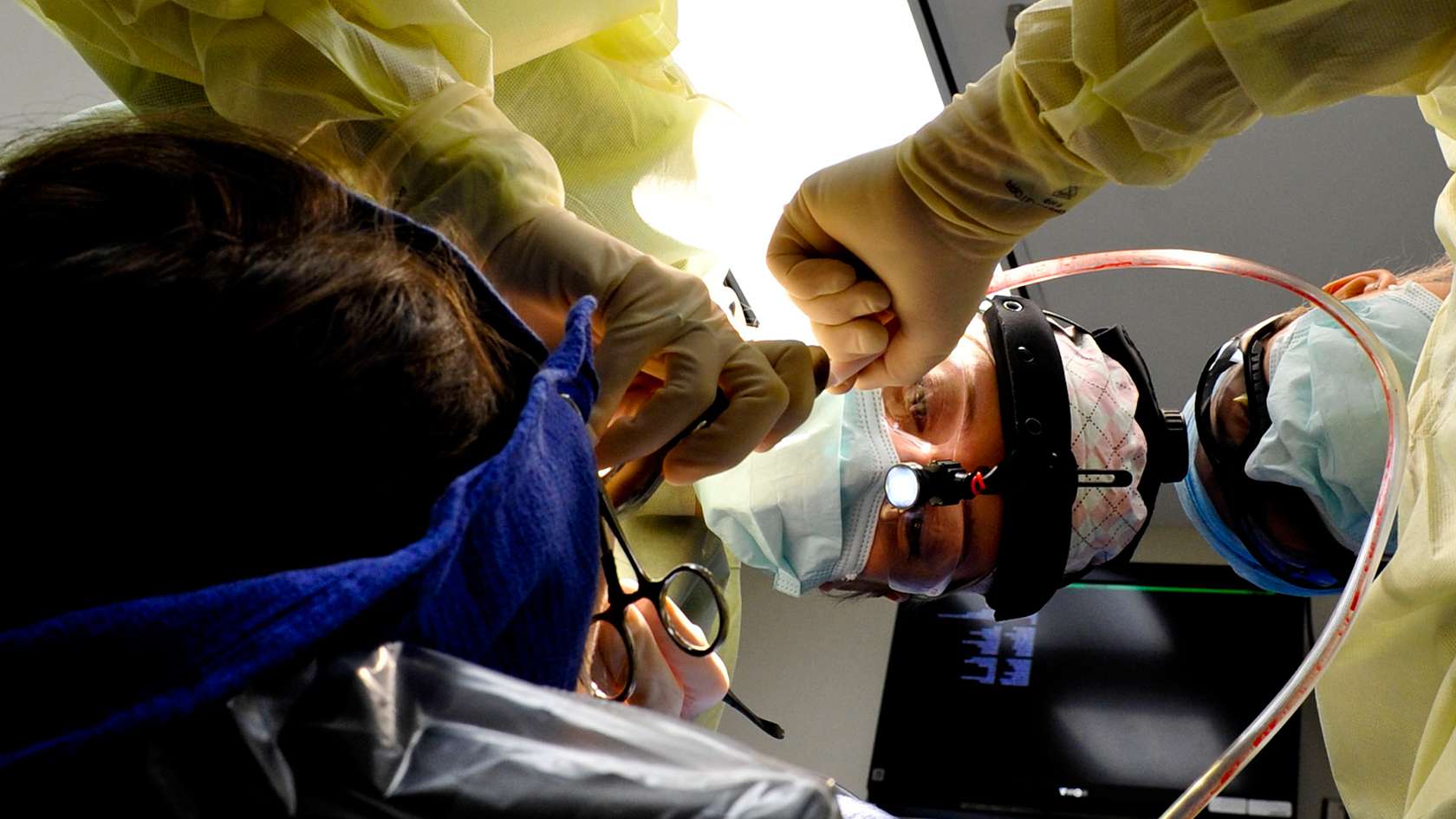 dental surgeon working on patient