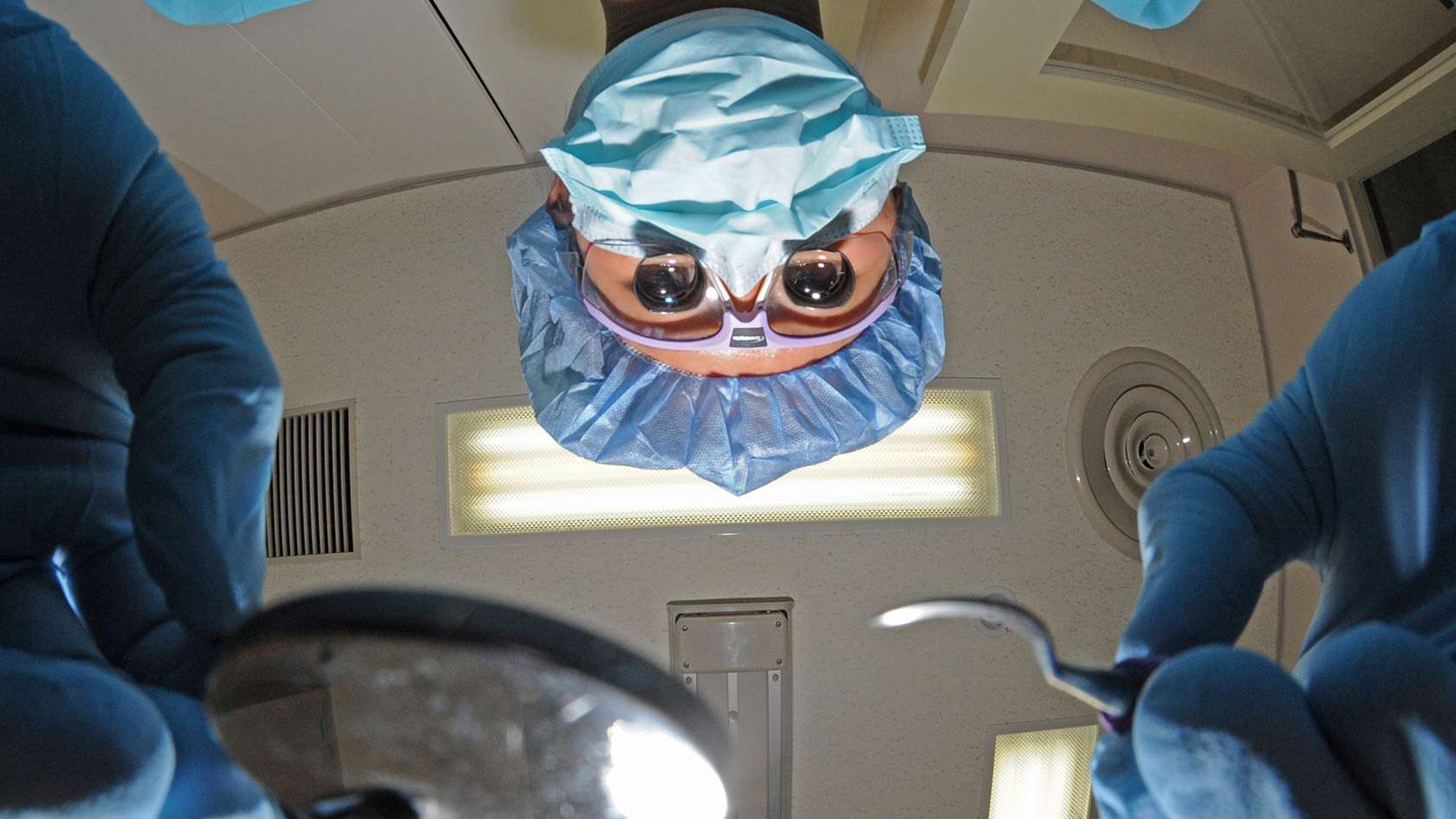 periodontist with instruments