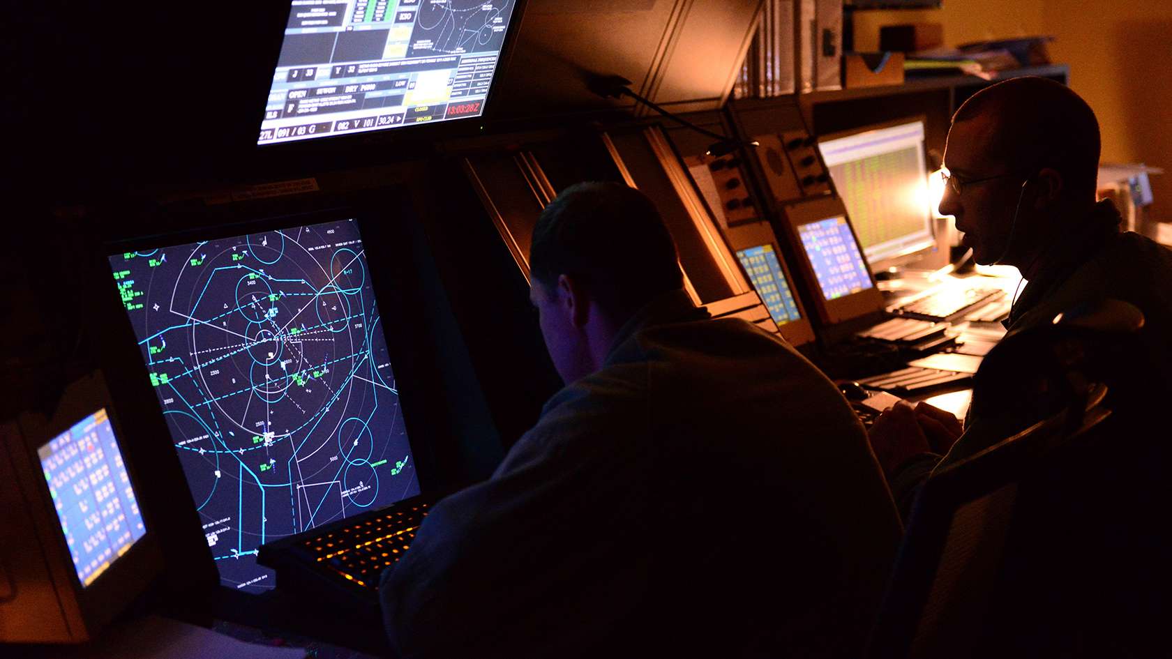 airmen reviewing computer screen content