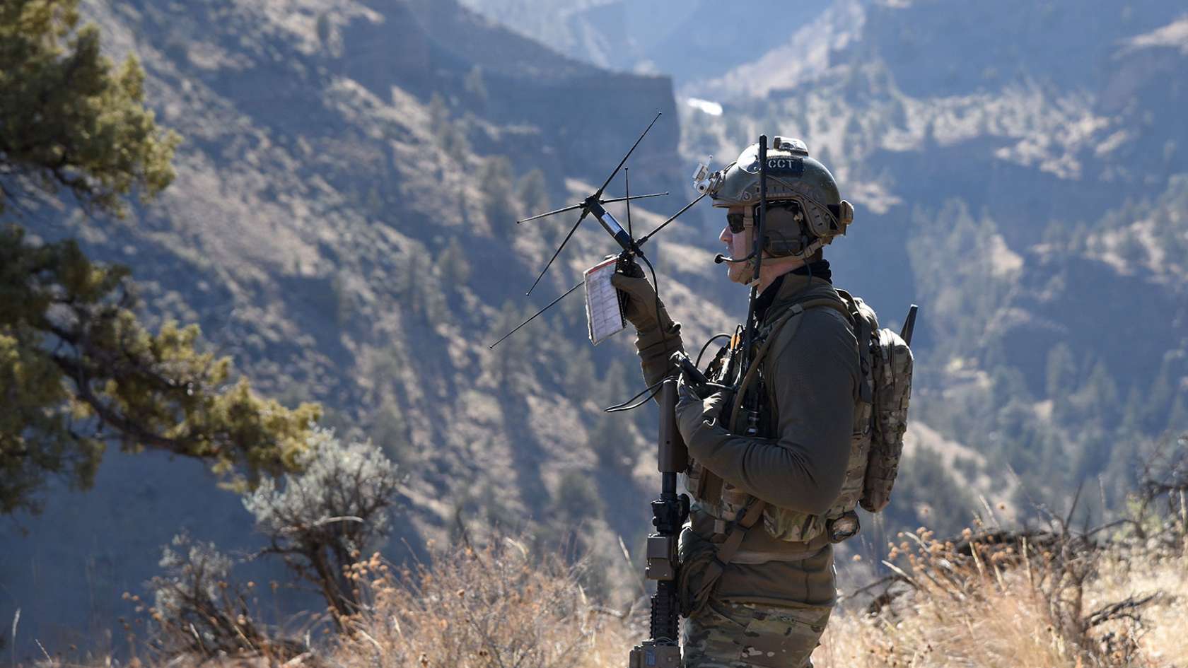 airman standing in the mountains