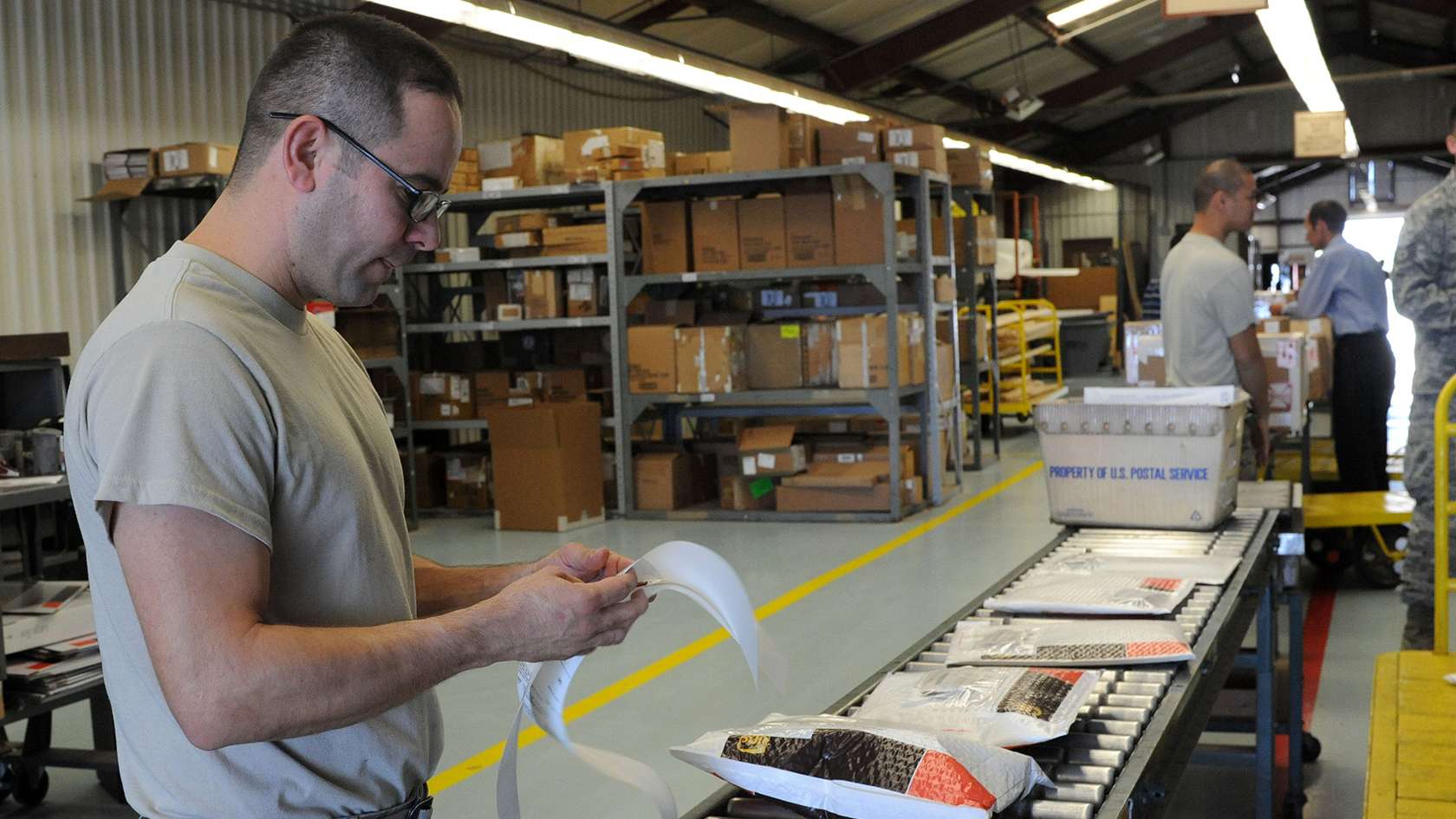 airman sorting packages