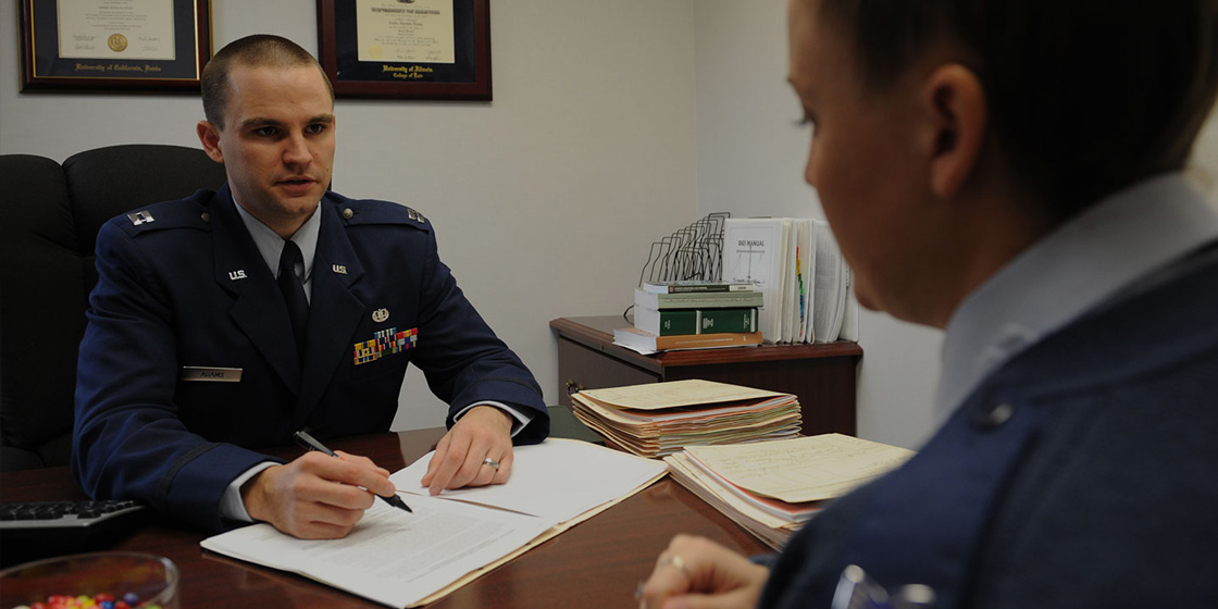 Two Air Force JAGs discussing a legal matter