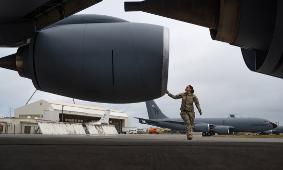 female airman next to engine