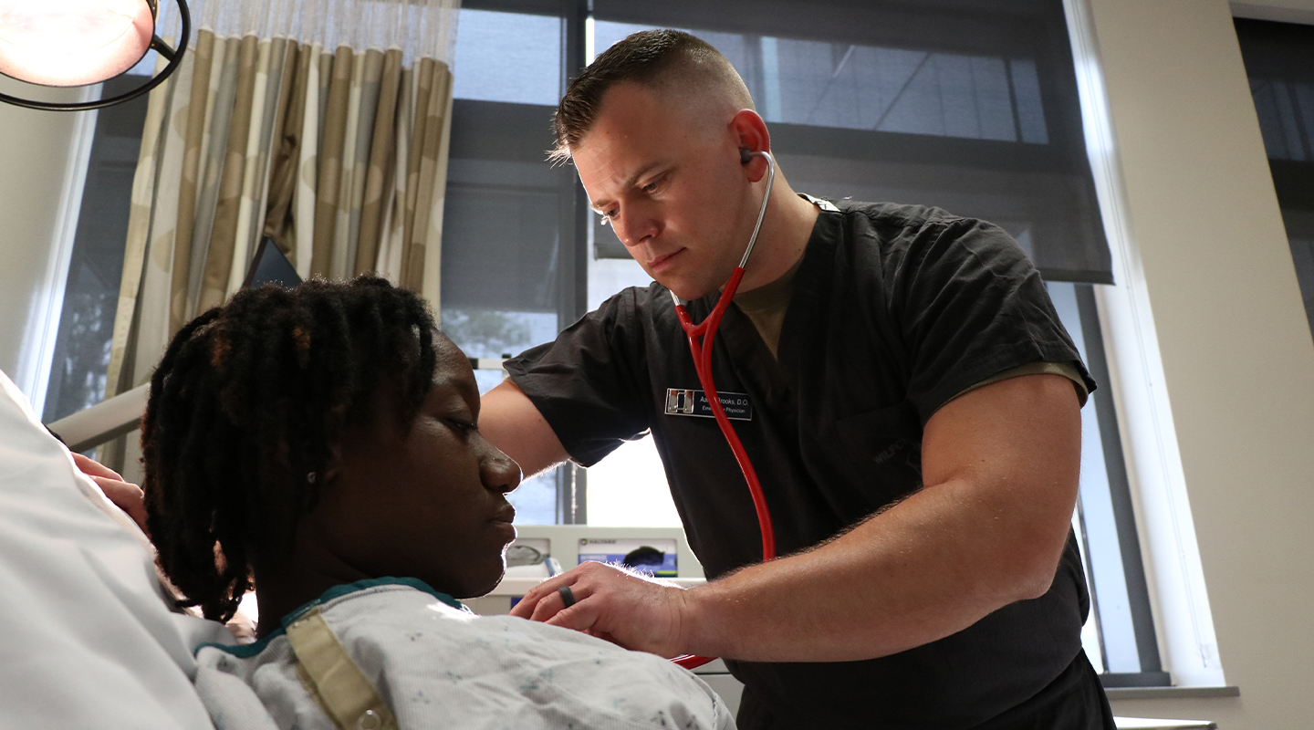 airman checking patient with a stethoscope