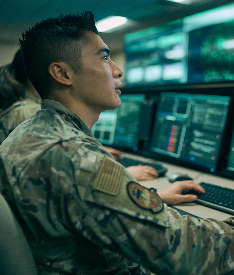 Airman reading cyber screen