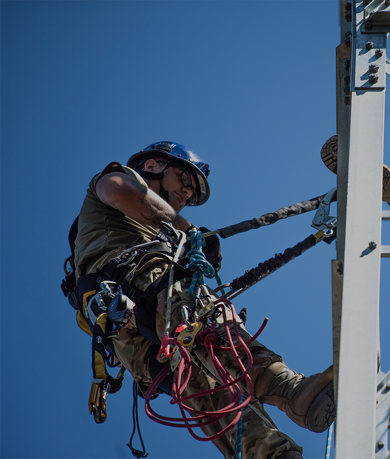 airman working on an cabling and antenna equipment