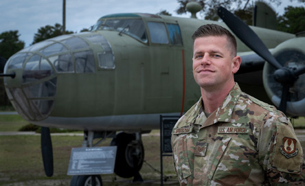 Airman Standing in Front of Aircraft