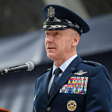 Gen Allvin speaking in front of a mic