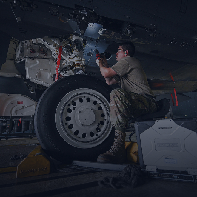 maintainer working on aircraft