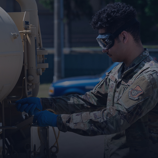 Airman working with tanks