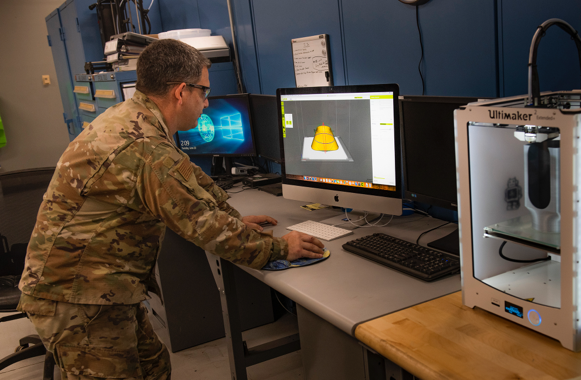 Airman creating 3D-printed parts