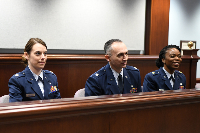 three JAG attorneys sitting in court