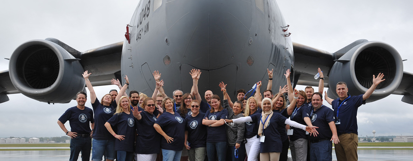 First Leadership Experience Attendees Standing by Aircraft