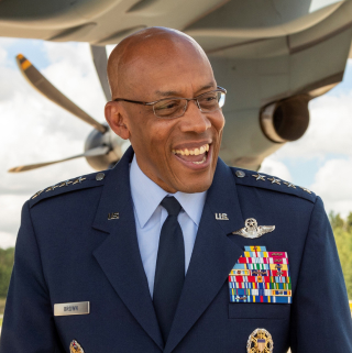 The decorated General Brown smiles in uniform 