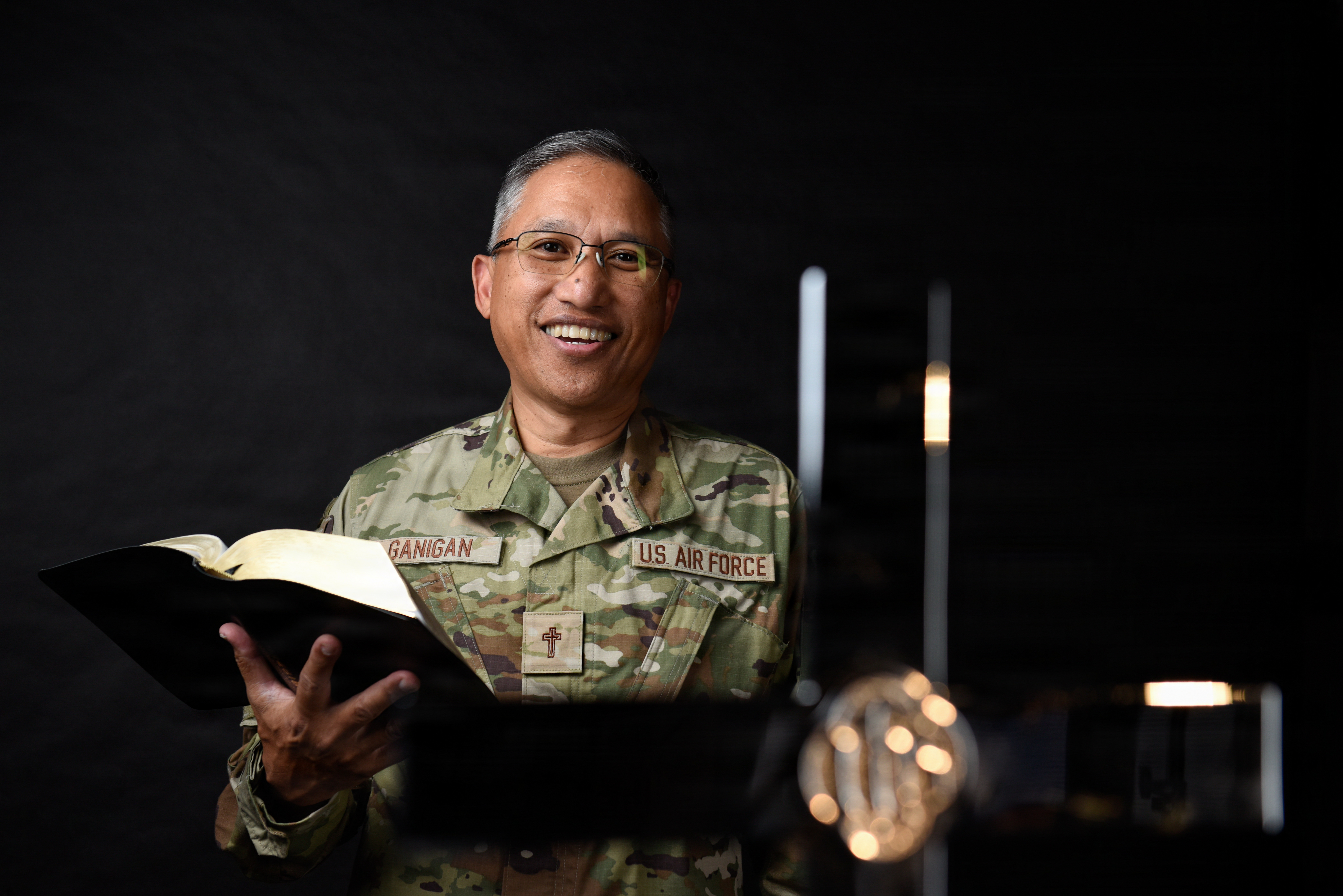 chaplain holding a bible