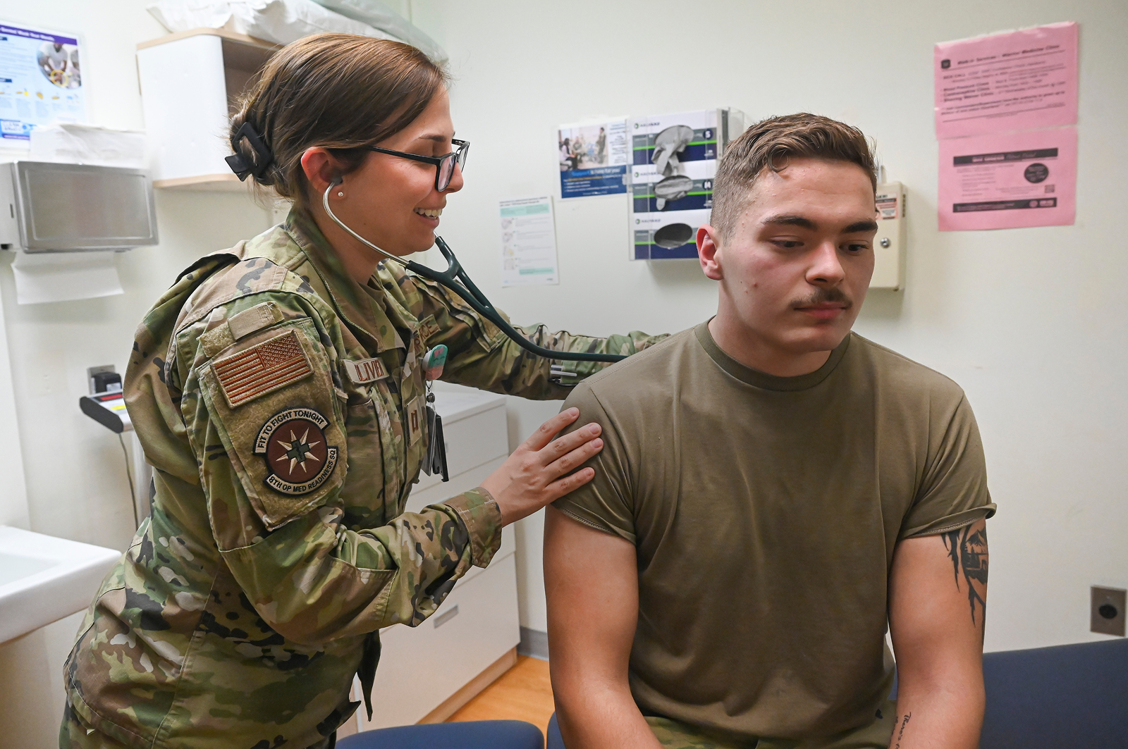 physical medicine physician checking heartbeat