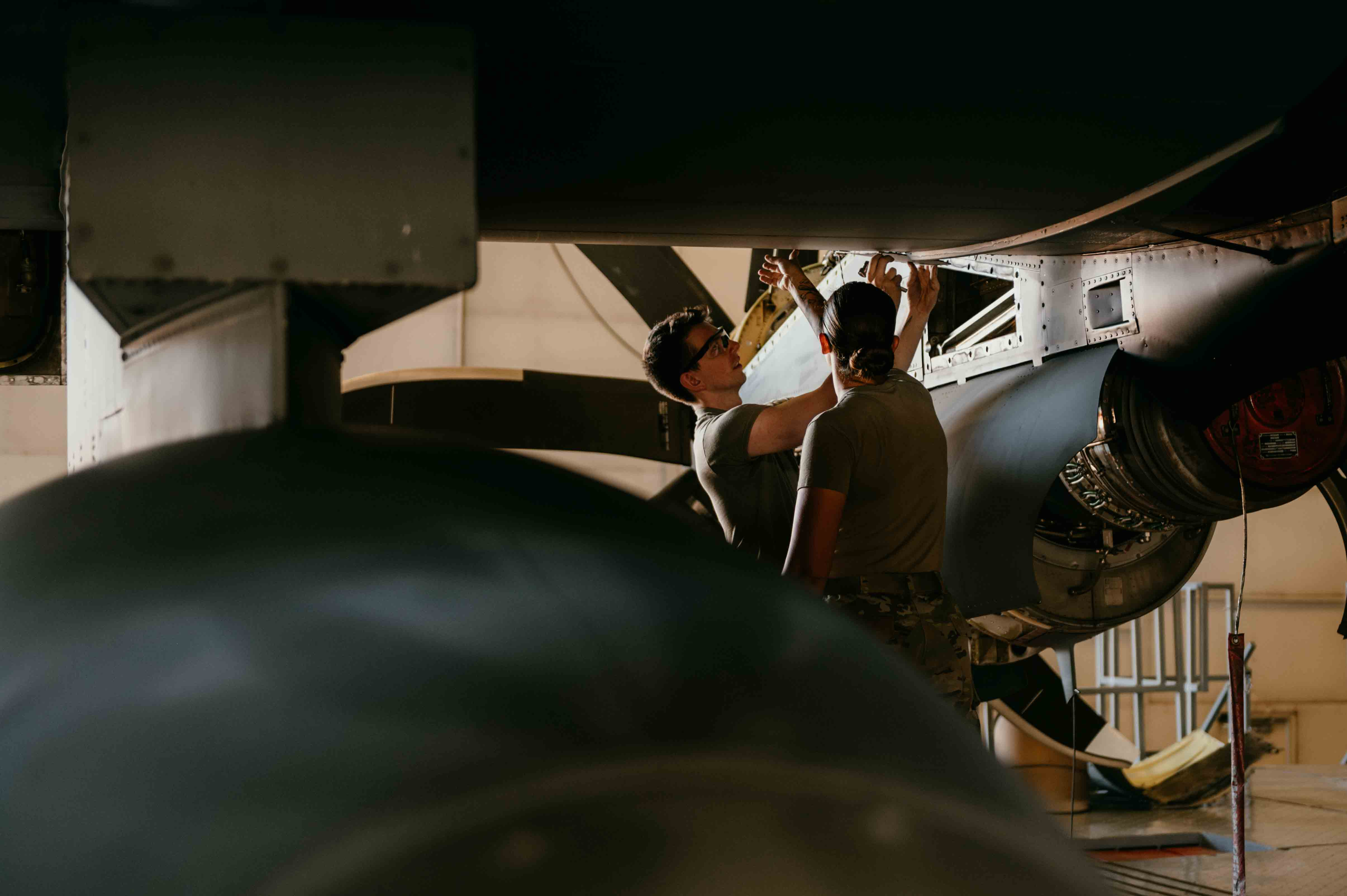 Airmen working on a plane