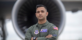 Pilot in front of aircraft engine