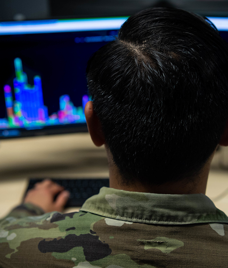 airman working in front of a computer screen