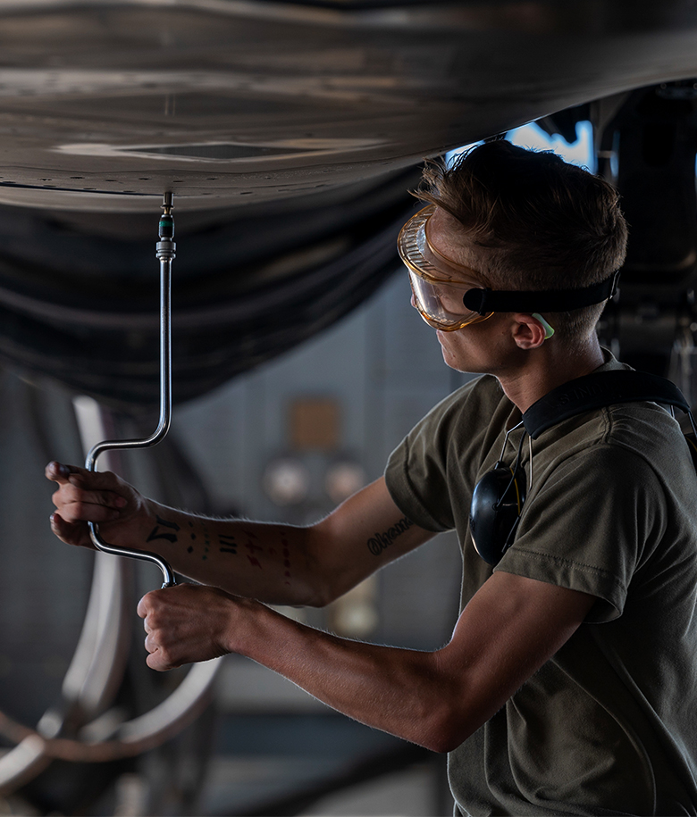 airman working on a plane