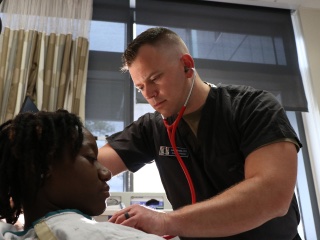 Man using stethoscope