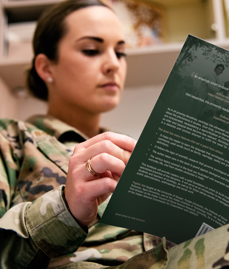 Airman with textbook studying