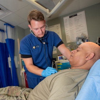 Airman using stethoscope