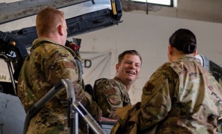 Airmen talking by aircraft