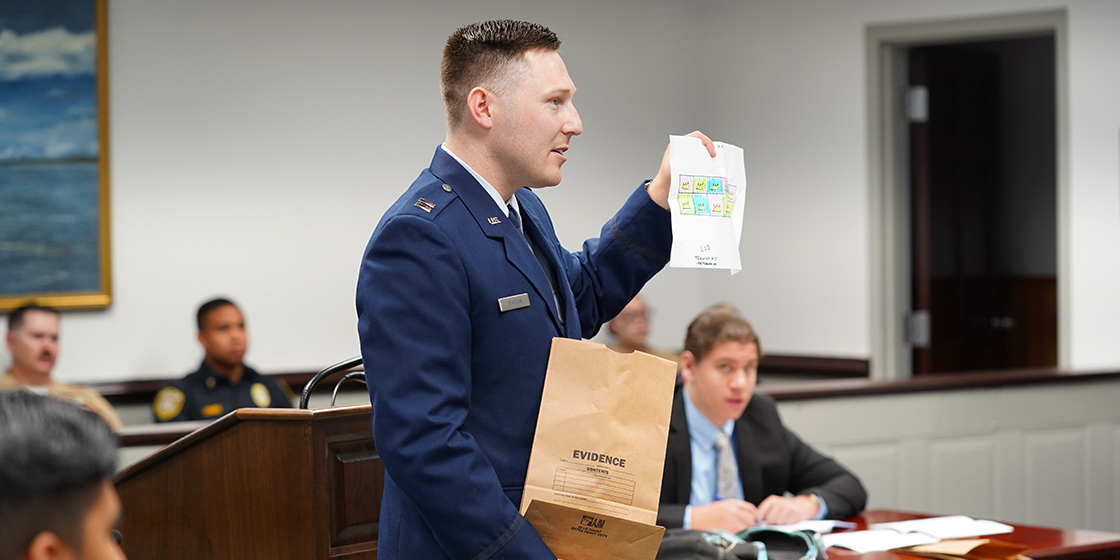 JAG presenting document to the judge
