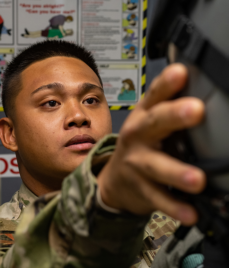 airman holding up equipment