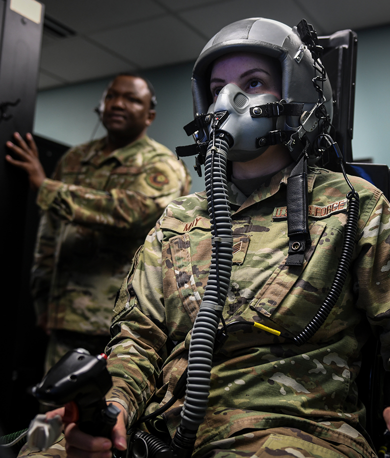 airmen in front of computer screens conducting training