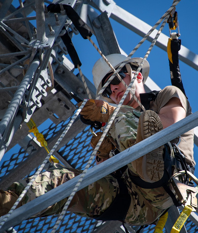 airman working on an cabling and antenna equipment