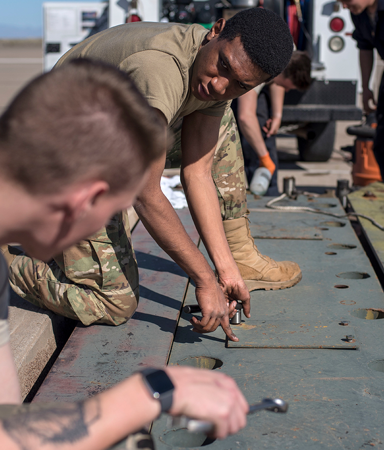 airmen performing maintenance on electrical power
