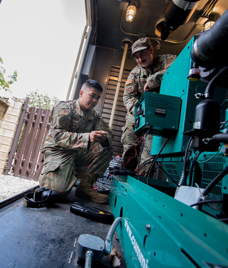 airmen working on equipment