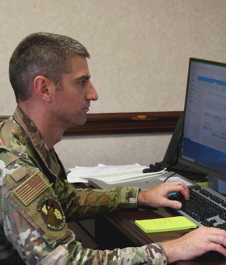 airman working on desktop computer