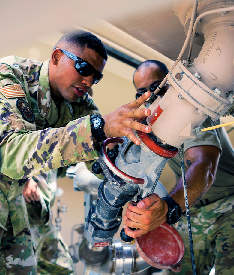 airmen working on equipment