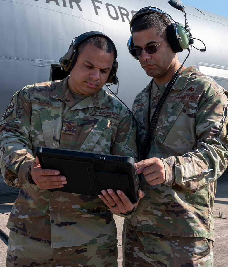airmen looking at a device