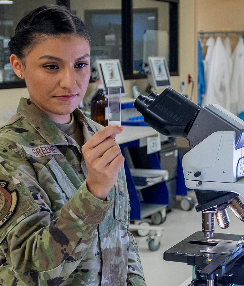 airman inspecting lab results