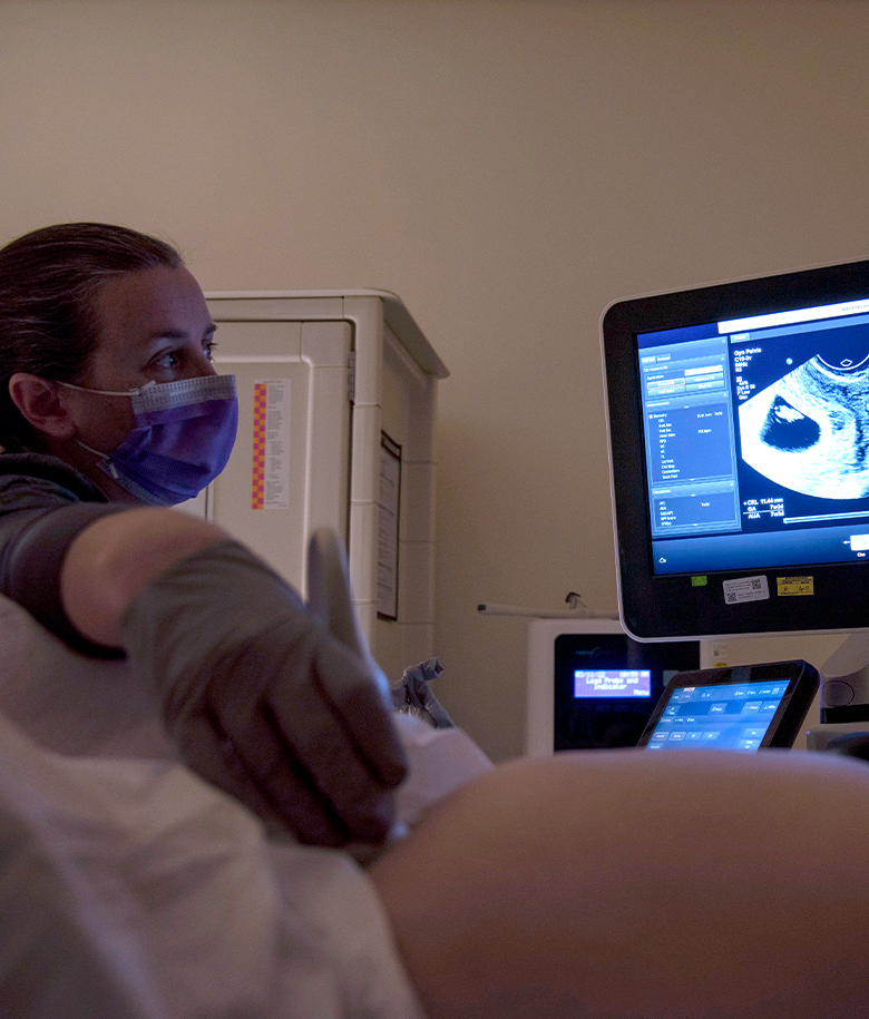 WOMEN'S HEALTHCARE NURSE PRACTITIONER conducting ultrasound