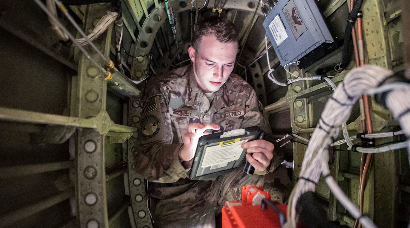 airmen working in cockpit