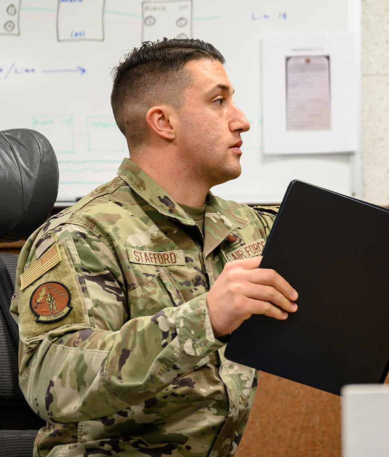 airman operating a control board