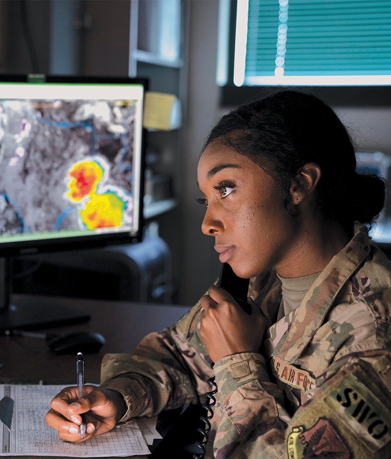 airman on phone taking notes